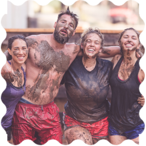 A group of people covered in mud at India Yoga School.
