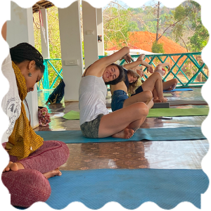 People are attending Yoga classes at India Yoga School A group of people doing Yoga at India Yoga School.