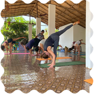 People are attending Yoga classes at India Yoga School A group of people doing Yoga at India Yoga School.