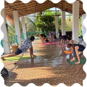 A group of people doing Yoga at India Yoga School.