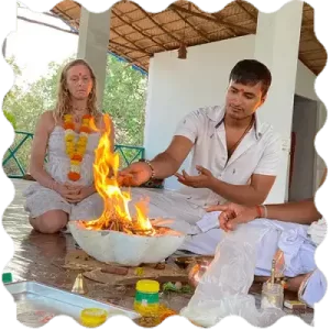 People are doing fire ritual at India Yoga School.